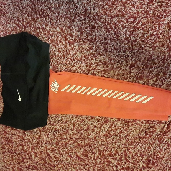 Nike leggings.  Mesh bottom from the knee down. Size small. Black and a pink. - Picture 3 of 4